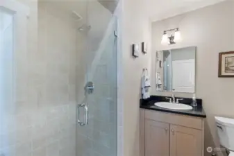 Main floor 3/4 bath with walk-in tiled shower.