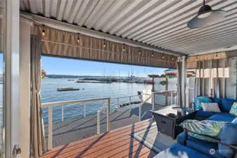 Enjoy year-round use from this covered deck that features a heated seating area and stairs leading to main deck.