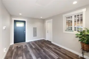 Front entry into foyer leading to home. Door to right opens garage.