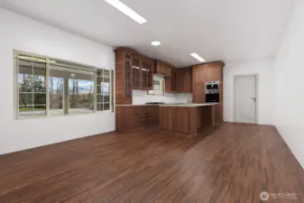 Virtually staged. Spanning 2,368 square feet, this lower-level basement is framed, wired, and plumbed for a kitchen, two spacious bedrooms and two bathrooms, along with the addition of a cozy fireplace.