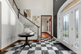 Virtually staged. The elegant black and white marble floors are wired to be heated.