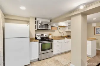 Full kitchen. Washer and dryer to left of fridge. Mini split for comfortable living.