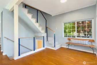 Roomy entry way! Stairs go down to lower level MIL style apartment. And up the stairs to 2 upper bedrooms, and 3/4 bath with laundry