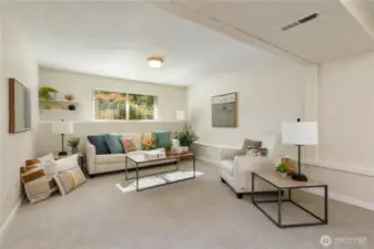 Huge great room in the lower level with access to beautiful backyard.