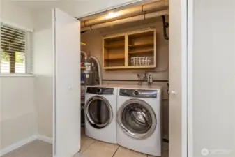 Huge laundry space are off lower level family room.