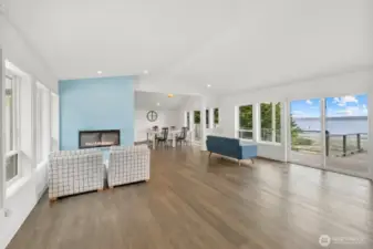 Open Living area with vaulted ceiling and water views