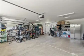 3 car garage with 4th lawn mower garage door