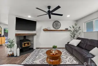 Enjoy cozy winter evenings by the wood stove in the living room.