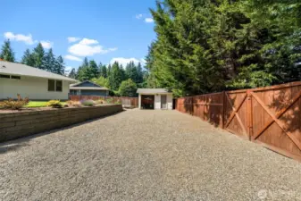 Gated double doors provide easy access to the backyard and shed.