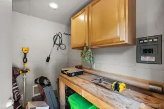 Inside includes storage and a work bench.