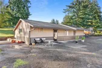The 1991 Cabin has 3 sleeping rooms and a back door to the outdoor gathering area.