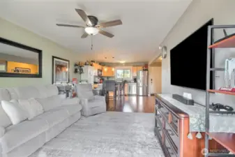 Living room looking into dining area and kitchen