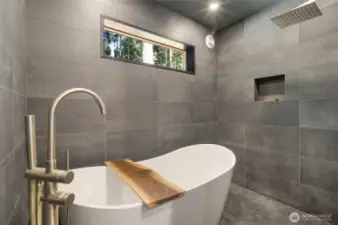 Primary bath with soaking tub and rainfall shower head