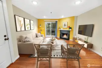 This spacious living room could be arranged  any number of ways. This photo is virtually  staged to illustrate one option.