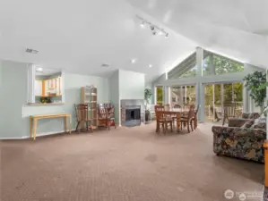Another view of the community clubhouse  towards the kitchen and fireplace.