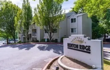 There are two entrances to Renton Ridge off  Aberdeen Ave NE. The Northern-most  entrance has this sign. The community  center, pool, and hot tub are to the left of  this. Building F is past the community center  Westbound, just past the BBall court and  BBQ area.