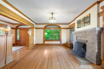 Formal living room overlooks the front porch and has a grand fireplace as an anchor.