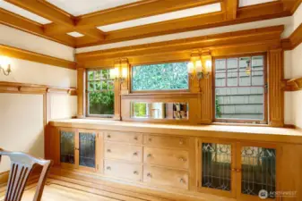 Honey colored built-ins anchor the dining room.