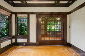 Gorgeous stained glass pocket door to enclose the Informal/TV room on the main floor.