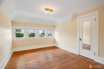 Top floor west facing bedroom, flanked by large closets on both sides. There is an equally sized bedroom on the east side of the house.