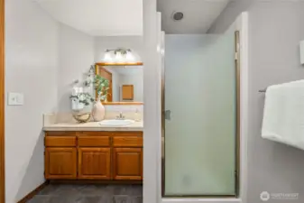 The primary bathroom features a shower and seperate bath tub