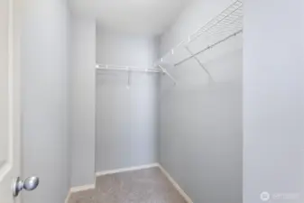 Primary bedroom walk-in closet