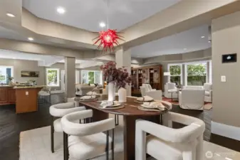 The open-concept layout flows effortlessly from the statement-making foyer to the versatile living and dining spaces.