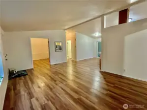 Living room leading to dining room and office/bedroom