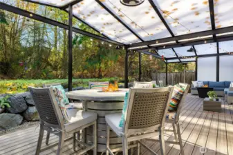 Enjoy year-round outdoor living on the spacious back deck featuring low-maintenance composite decking and a translucent covered roof that filters natural light while keeping the elements out. The deck overlooks 16 acres of Greenbelt, offering peaceful privacy, greenery, and wildlife views with no neighbors behind you.