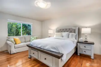 Primary bedroom is generously sized with a walk in closet & en-suite.