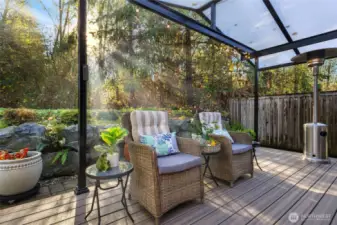 Enjoy year-round outdoor living on the spacious back deck featuring low-maintenance composite decking and a translucent covered roof that filters natural light while keeping the elements out. The deck overlooks 16 acres of Greenbelt, offering peaceful privacy, greenery, and wildlife views with no neighbors behind you.