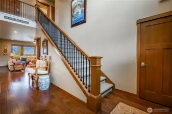 Beautiful entry with high ceilings, office OR 4th bedroom to left of photo. Quality-stained woodwork throughout home and wood floors on main level.