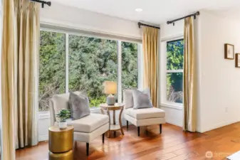 Bedroom Sitting Area space with large windows providing forest views