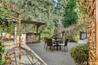 Walk through arbor to private backyard with BBQ, Firepit, pond, garden beds and sport court!
