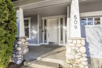 Covered porch entry with elegant sidelites