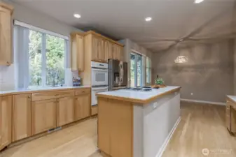 Unleash your inner gourmet chef with the gas cooktop on the island plus a double wall oven