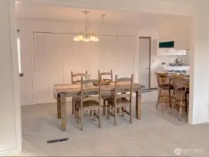 Dining area open to Kitchen and Living Room. Virtually staged