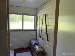 Back porch (those are pants drying stretchers on the wall)