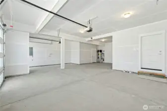 3 Car Garage w/ Shop space.