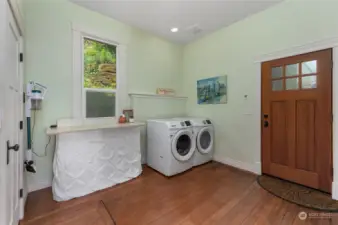 Large laundry room and door into backyard and shop areea