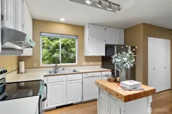 Picture perfect! This well designed, lovely kitchen has a walk - in pantry.