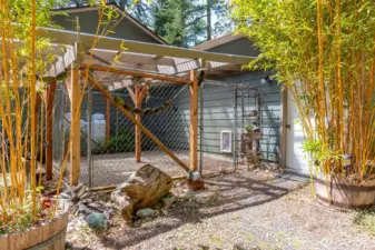 fabulous fenced in dog area off the garage!