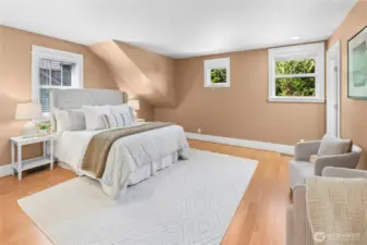 The primary bedroom with a connected bathroom and large walk-in closet.