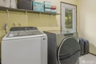 Laundry area/mudroom with access door to yard. Washer and dryer hookups available.