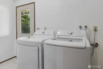 Laundry/mudroom with access door to backyard. Washer and dryer hookups available.