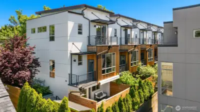 Notice two balconies off the kitchen and upstairs bedroom. Fenced Backyard with storage and separate access to lower level.