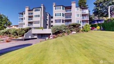 West side view & manicured grounds!