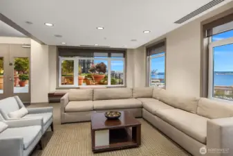 Amenity lounge opening to the large outdoor space with BBQ's on Floor 6.