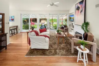A wall of windows and vaulted ceilings in your bright living room welcomes you into this beautiful home!