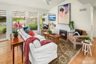 Such a cozy and inviting living space! The wood burning fireplace is a sweet bonus.